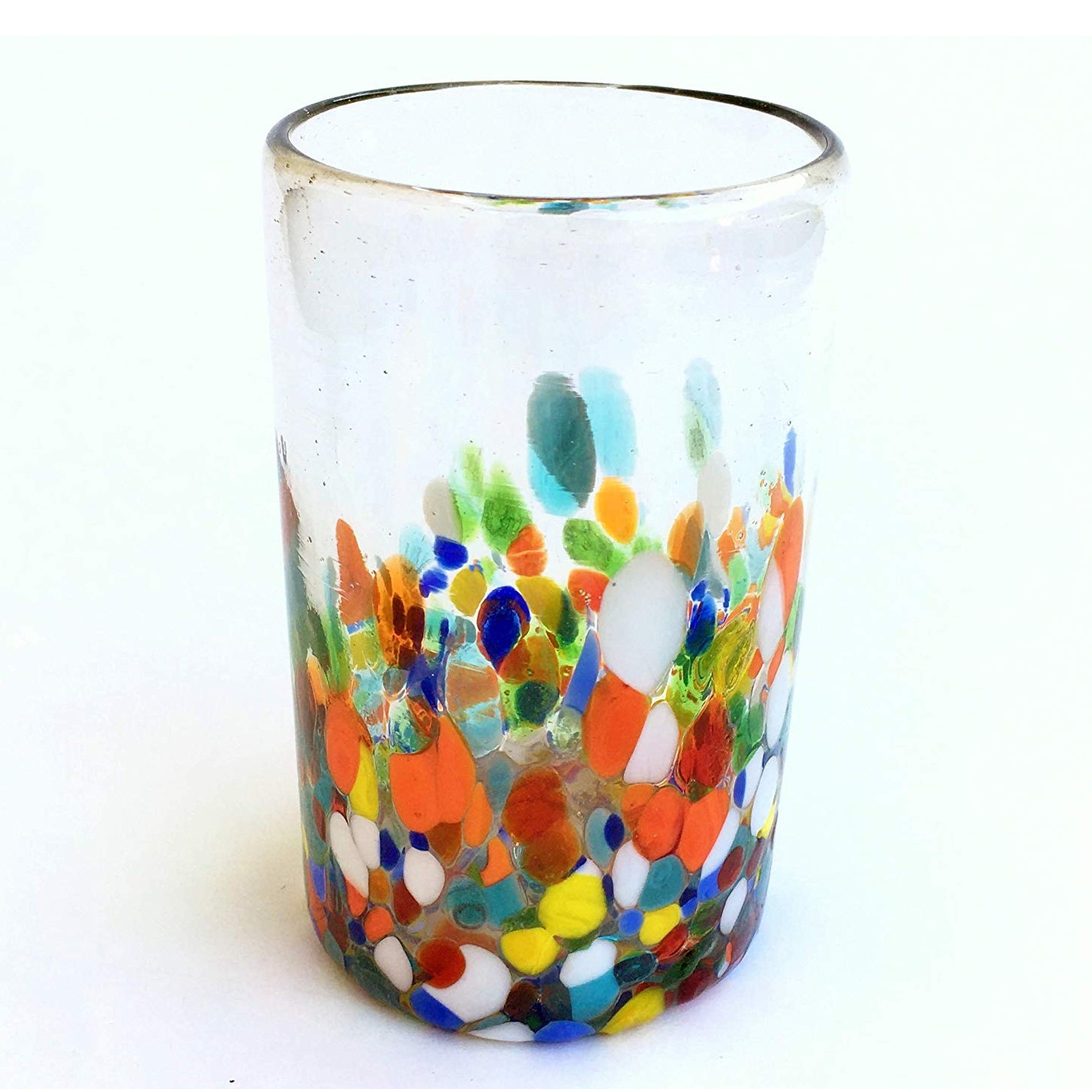 Confetti Glassware / Clear & Confetti 14 oz Drinking Glasses (set of 6) / Our Clear & Confetti drinking glasses combine the best of two worlds: clear, thick, sturdy handcrafted glass on top, meets the colorful, festive, confetti bottom! These glasses will sure be a standout in any table setting or as a fabulous gift for your loved ones. Crafted one by one by skilled artisans in Tonala, Mexico, each glass is different from the next making them unique works of art. You'll be amazed at how they make having a simple glass of water a happier experience. Each glass holds approximately 14 oz of liquid and stands a bit over 5